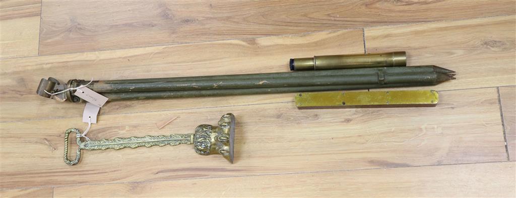 A WWII New Zealand tripod stand, Military issue, a telescope and a brass claw and ball door stop and a mounted spirit level